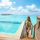 A woman next to the private pool with the Ocean in the background at Nala Maldives in the Ocean Pool Villas