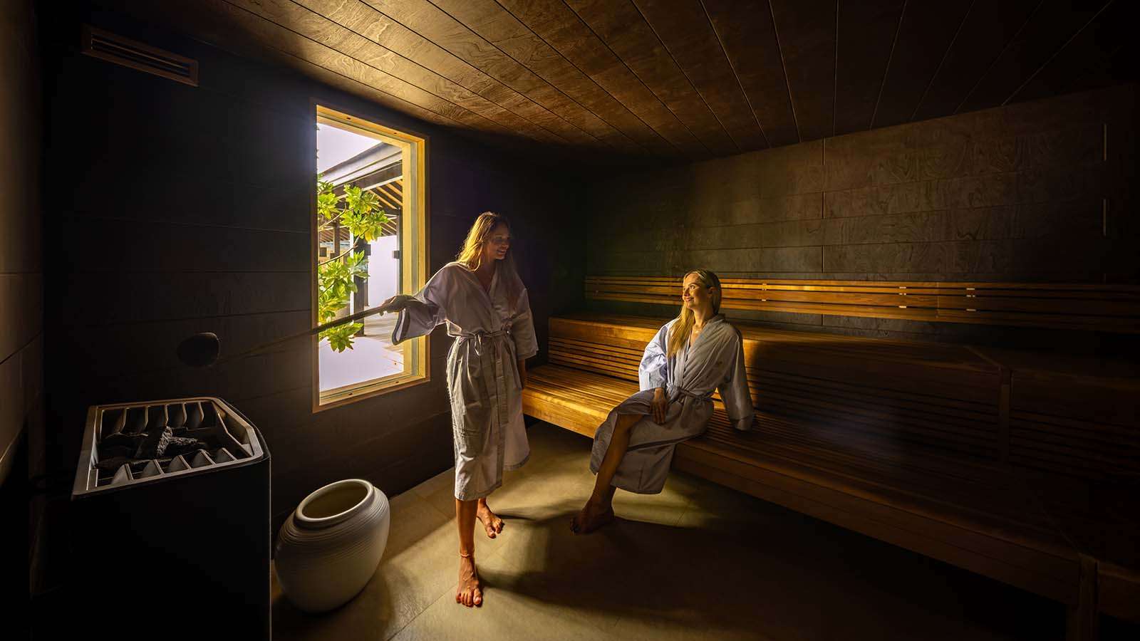 Two women in the steam room at The Sulha spa at Nala Maldives adults only resort