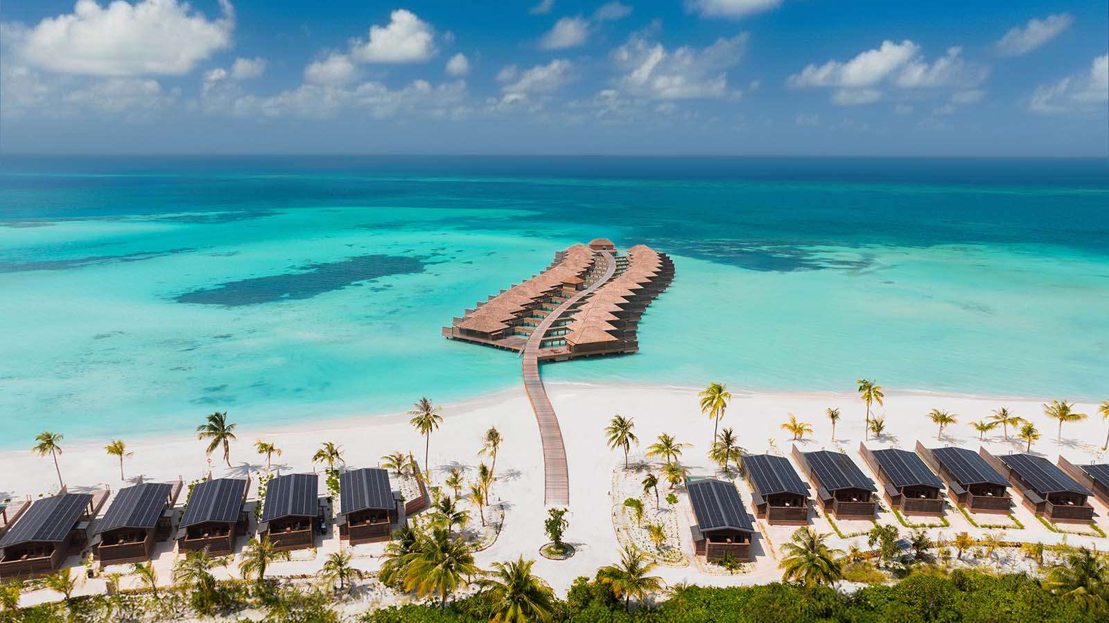 ariel view of overwater villas and beach at Nala Maldives adults only resort
